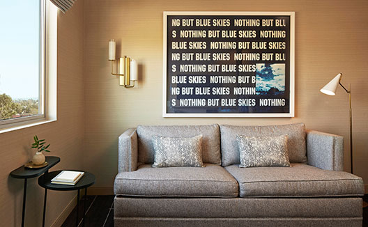 couch with artwork above